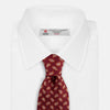 View 2 of product The Turnbull & Asser Red Abstract Paisley Silk Tie features bold orange and white paisley patterns on rich red silk—a stylish choice for fans of classic tailoring.