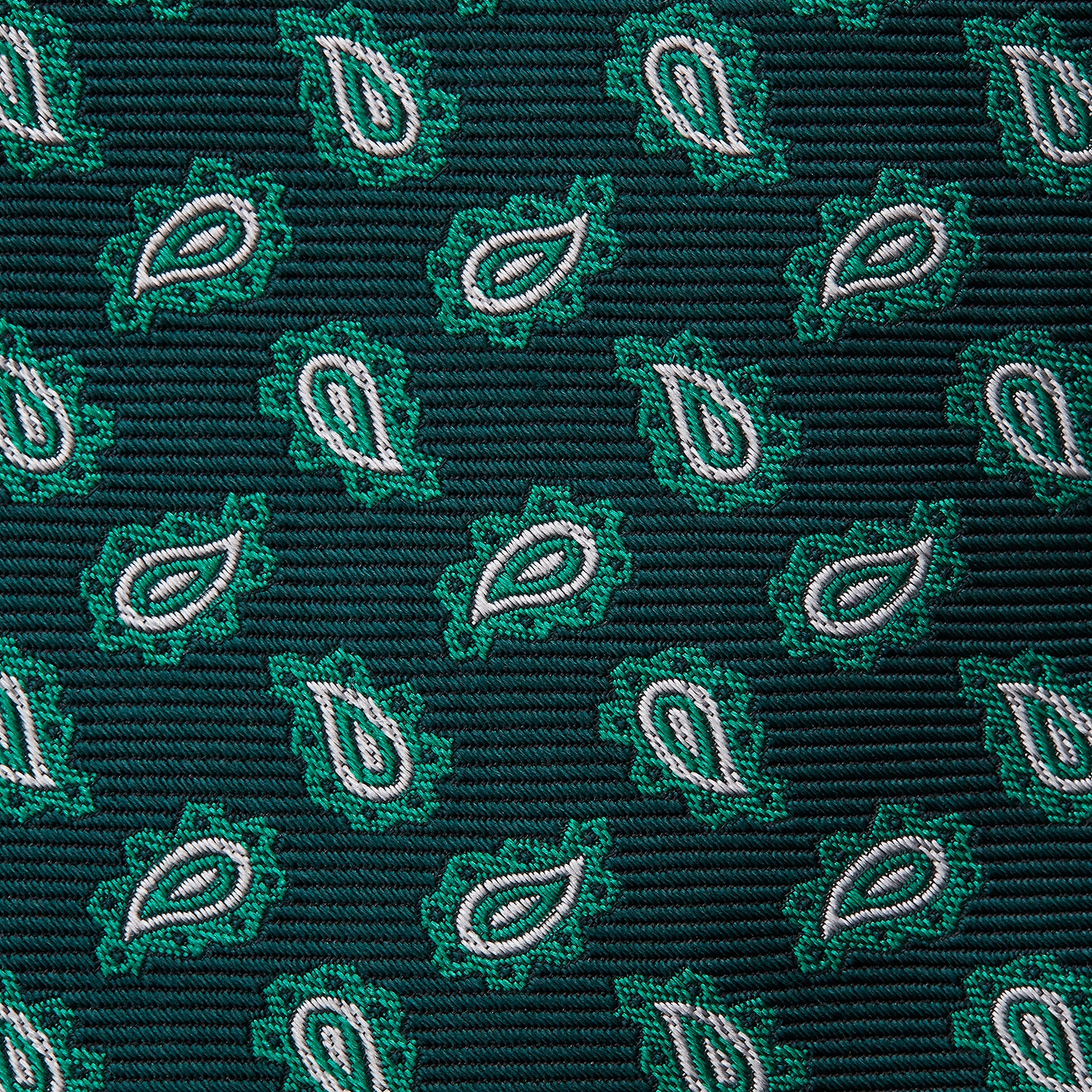 View 3 of product The Turnbull & Asser Green Abstract Paisley Silk Tie features a repeating light green paisley pattern on dark green silk, shown rolled up against a white background—a refined men’s accessory for making a statement.