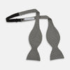 View 3 of product The Turnbull & Asser Fine Puppytooth Monochrome Silk Bow Tie, shown on a white background, features a black and white puppytooth pattern—ideal for wearing with formalwear or an evening shirt.