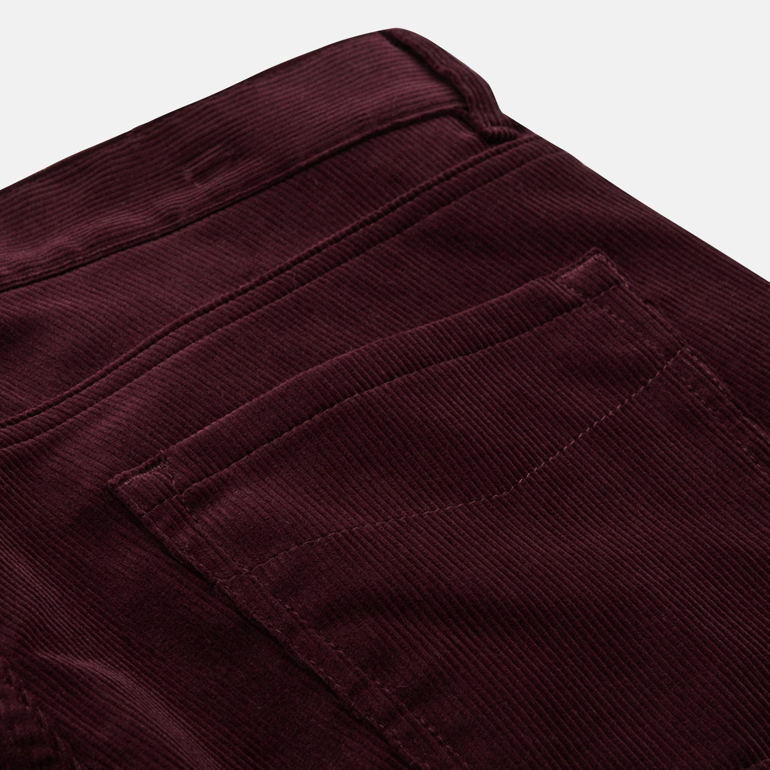 View 2 of product Plum Cord Mylo Trousers by Turnbull & Asser, featuring a classic five-pocket design, are shown laid flat on a white background.