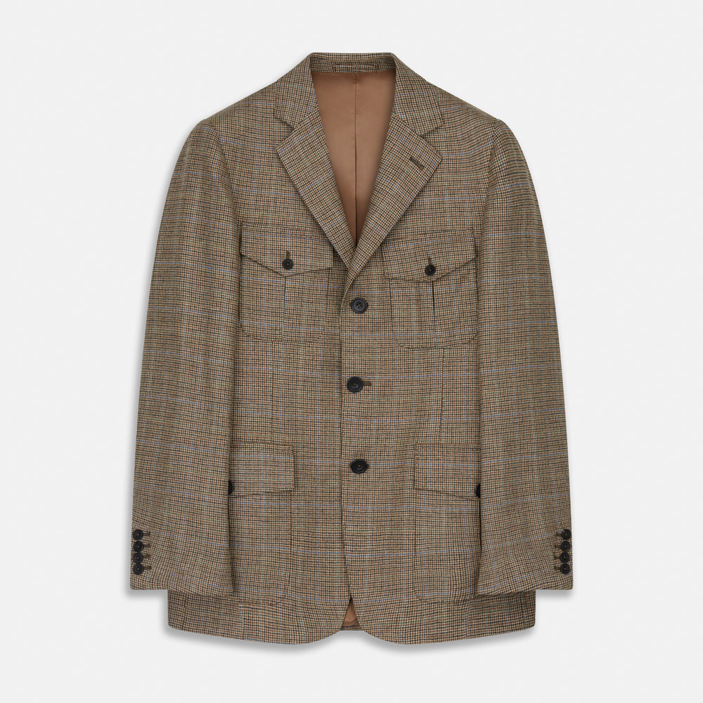 The Byron Wool Check Travel Jacket by Turnbull & Asser features a brown plaid pattern, notched lapel, four flap utility pockets, and dark buttons. This lightweight wool jacket is shown on a plain white background.