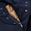 View 2 of product The Turnbull & Asser Navy Walter Sealup Parka with Detachable Liner features silver snap buttons, front flap pockets, and a drawstring hem. Styled against a white background, this waterproof parka offers both elegance and practicality for wet weather.