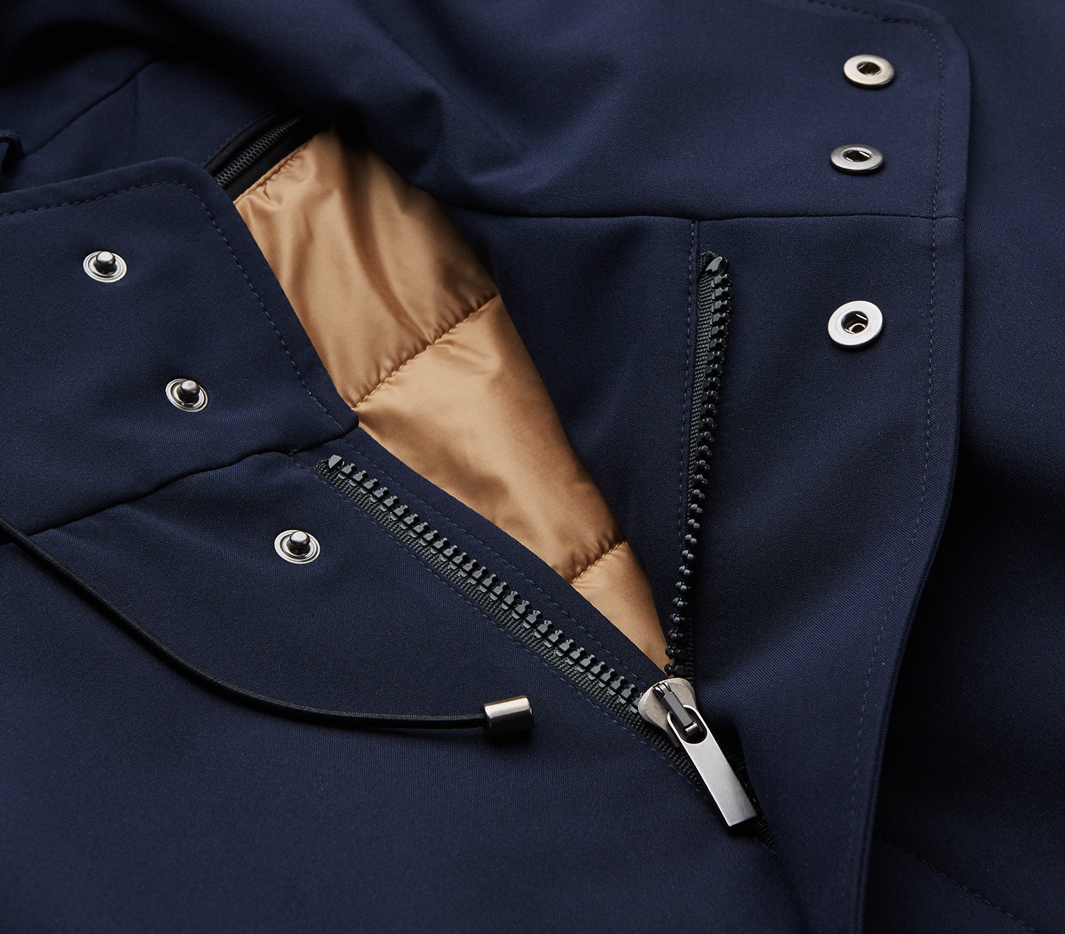 View 2 of product The Turnbull & Asser Navy Walter Sealup Parka with Detachable Liner features silver snap buttons, front flap pockets, and a drawstring hem. Styled against a white background, this waterproof parka offers both elegance and practicality for wet weather.