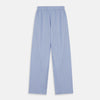 View 4 of product A man stands barefoot against a plain background, wearing a white short-sleeve T-shirt and Turnbull & Asser Blue Stripe Cotton Pyjama Trousers in a contemporary fit, looking straight ahead with a neutral expression.