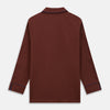 View 7 of product The Turnbull & Asser Red Cotton-Cashmere Pyjama Set features a rust-red long-sleeve button-up top with chest pocket and matching waist-tied pants, shown on a plain white background.