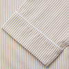 View 3 of product The Turnbull & Asser Sand Bengal Stripe Modern Fit Cotton Pyjama Set features cream-colored striped Italian cotton, with a long-sleeved button-up top and matching drawstring pants, neatly displayed against a white background.