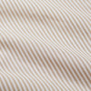 View 4 of product The Turnbull & Asser Sand Bengal Stripe Modern Fit Cotton Pyjama Set features cream-colored striped Italian cotton, with a long-sleeved button-up top and matching drawstring pants, neatly displayed against a white background.
