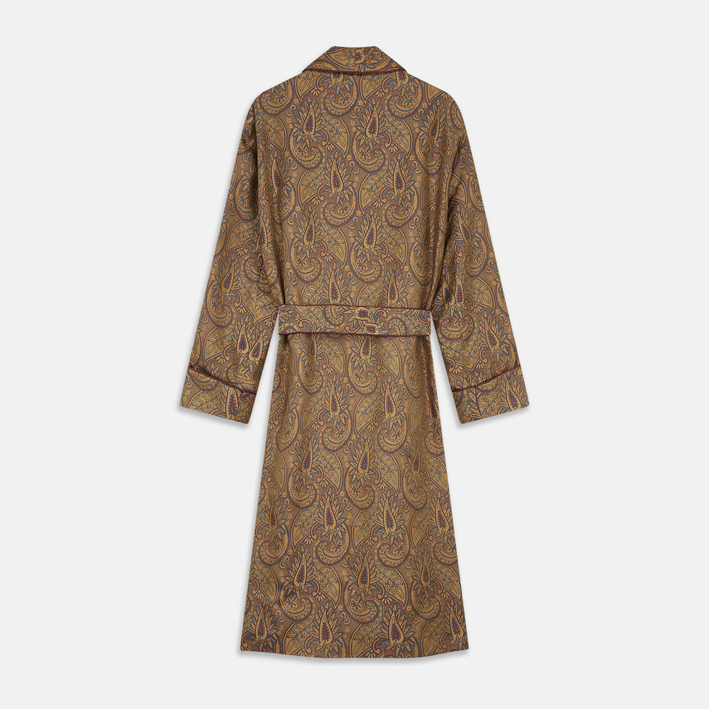 The Turnbull & Asser Gold Paisley Traditional Silk Jacquard Gown features a brown and gold paisley pattern, shawl collar, front pockets, and matching fabric belt. Displayed on a white background, it’s perfect for winter comfort.