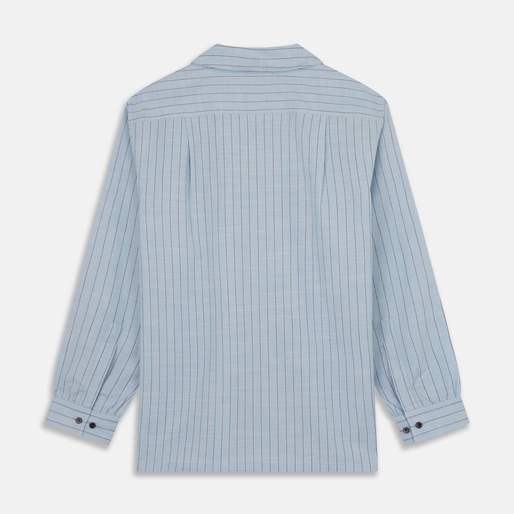 Turnbull & Asser's Pale Blue Stripe Cotton Holiday Fit Shirt features a revere collar, thin black pinstripes, single button cuff, chest pocket, and black buttons—crafted from Italian cotton and laid flat on a white background.