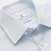 View 2 of product The Turnbull & Asser Pale Blue Stripe Regular Fit Sea Island Quality Cotton Shirt features a T&A collar and 3-button cuffs, laid flat on a white background.