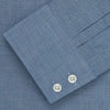 View 3 of product The Turnbull & Asser Blue Tailored Fit Shirt features a Kent collar, 2-button cuffs, and white buttons—a versatile men’s wardrobe essential. Laid flat on a white background.