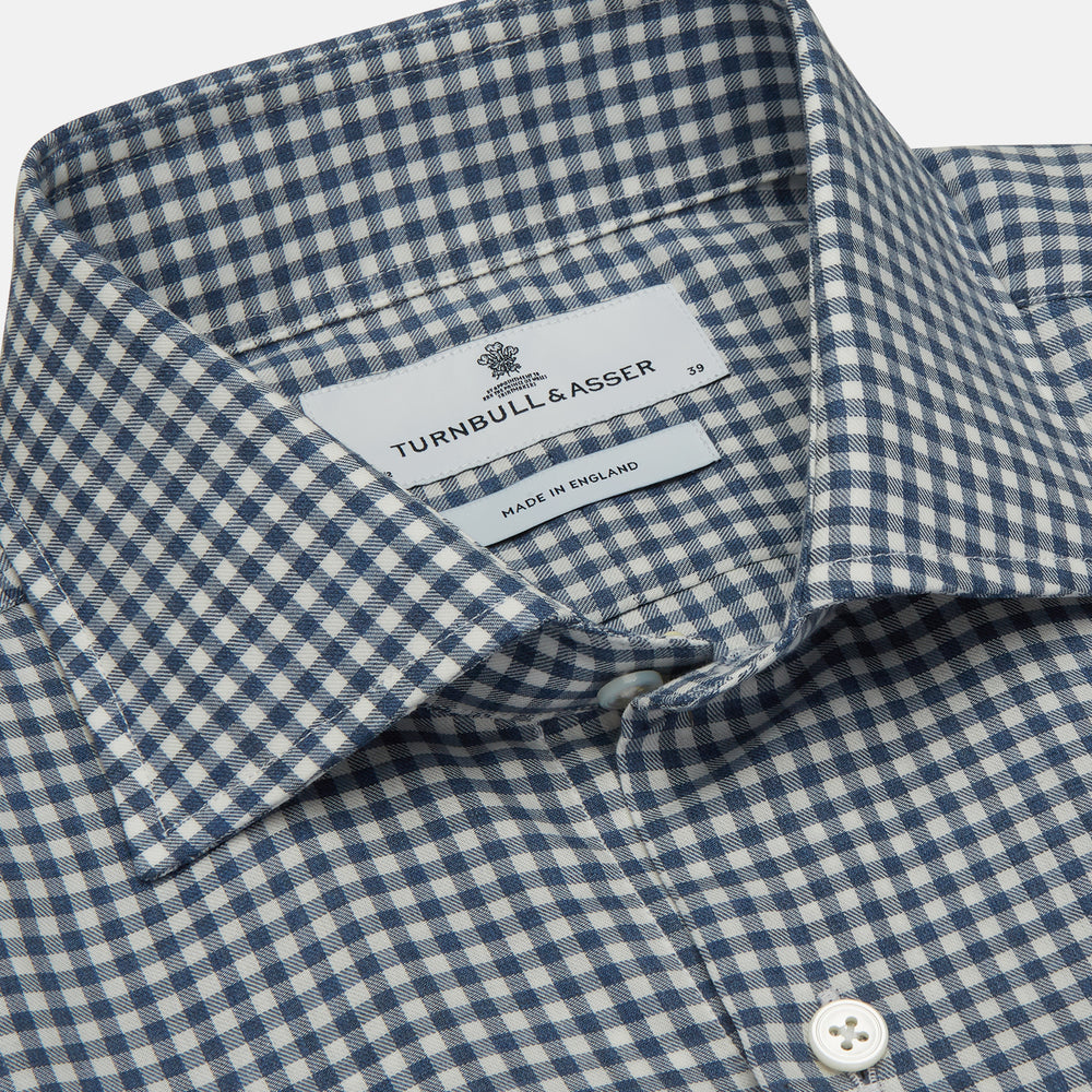 The Turnbull & Asser Blue Multi Check Tailored Fit Shirt features a Kent collar, 2-button cuffs, and a fine blue and white checked pattern—an essential men's wardrobe piece—shown flat on a white background.