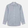 View 1 of product The Turnbull & Asser Sky Blue Linen Stripe Weekend Fit Shirt features blue and white vertical stripes, a Derby collar, and buttoned cuffs—ideal for pairing with classic cotton suits or other Weekend Fit shirts.