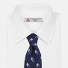 View 2 of product The Turnbull & Asser Navy Multi Circle Silk Tie showcases overlapping light blue and white rings on navy silk—a stylish choice to elevate bold shirts or bring visual interest to your summer look.