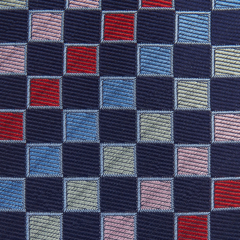 The Pink Multi Check Silk Tie by Turnbull & Asser features blue, red, and light green squares on a white background—an ideal summer accessory that complements bold shirts.