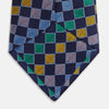 View 4 of product The Green Multi Check Silk Tie by Turnbull & Asser features a green checkered pattern with blue, yellow, and light purple squares on dark blue—ideal for bold shirts and a vibrant summer palette.