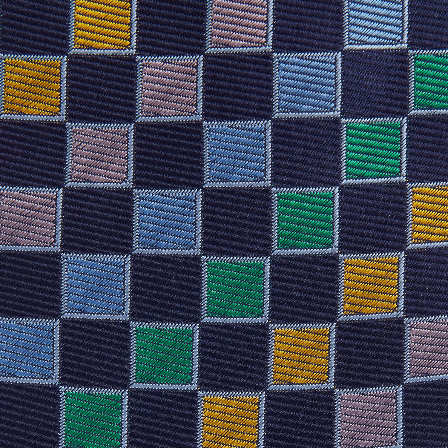 View 3 of product The Green Multi Check Silk Tie by Turnbull & Asser features a green checkered pattern with blue, yellow, and light purple squares on dark blue—ideal for bold shirts and a vibrant summer palette.