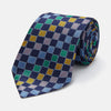 View 1 of product The Green Multi Check Silk Tie by Turnbull & Asser features a green checkered pattern with blue, yellow, and light purple squares on dark blue—ideal for bold shirts and a vibrant summer palette.