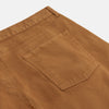 View 2 of product Tan Stretch Cotton Five-Pocket Mylo Jeans by Turnbull & Asser, featuring a classic straight-leg cut, are displayed flat on a white background—showcasing timeless style and quality craftsmanship.