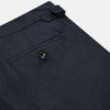 View 2 of product The Navy Escorial Wool Jonathan Trousers by Turnbull & Asser, featuring side adjusters, front pleats, and side pockets, are shown laid flat on a white background.