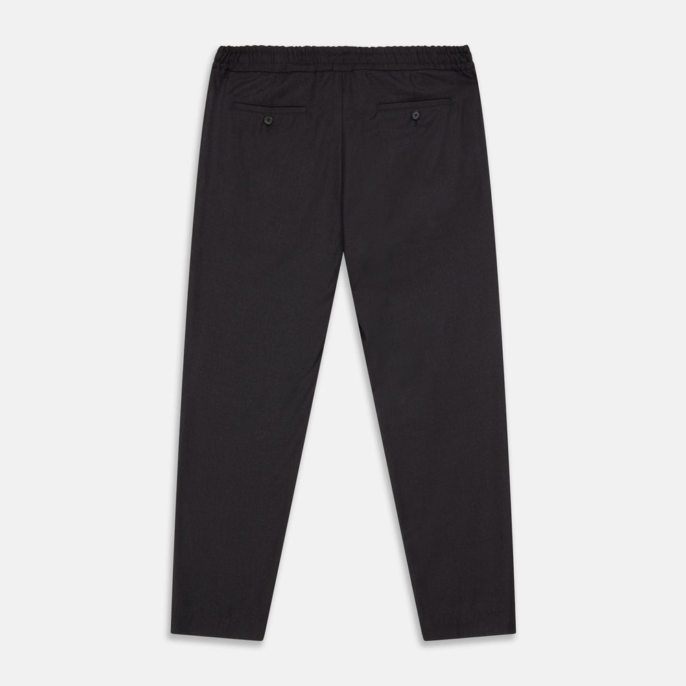 Turnbull & Asser Charcoal Tailored Drawstring Trousers in wool flannel, featuring an elastic waistband, straight legs, and side pockets, shown laid flat on a white background.
