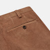 View 2 of product Turnbull & Asser’s Fawn Horizontal Cord Manson Trouser, tailored in Italy from brown cotton cord with straight legs, belt loops, and front button-zip closure, is shown laid flat on a white background.