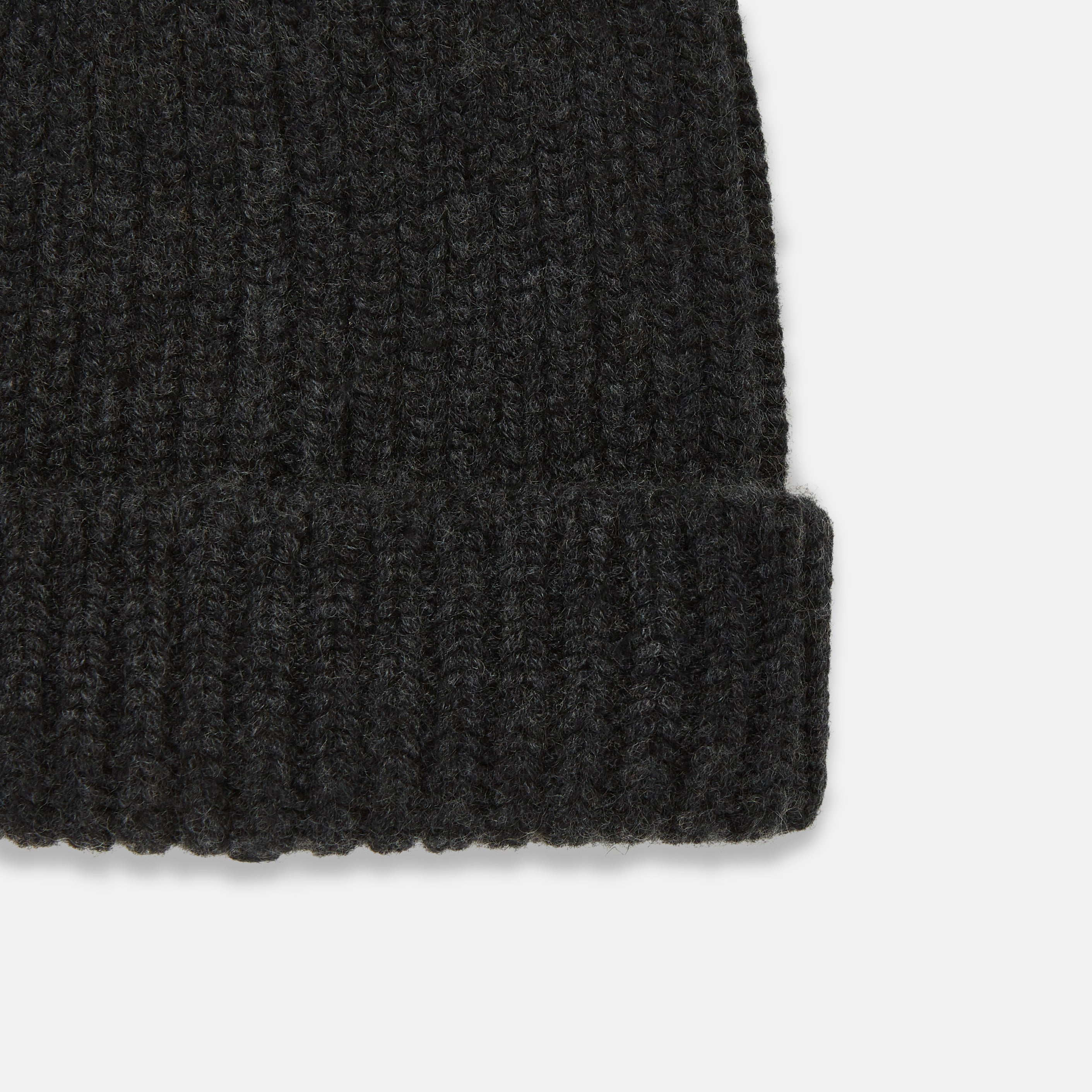 View 2 of product Turnbull & Asser's Charcoal Cashmere Ribbed Hat features a folded brim and soft cashmere construction, shown against a plain white background.