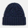 View 1 of product The Turnbull & Asser Navy Cashmere Cable Hat features a ribbed fold-over cuff and cable knit pattern, shown on a plain light background.