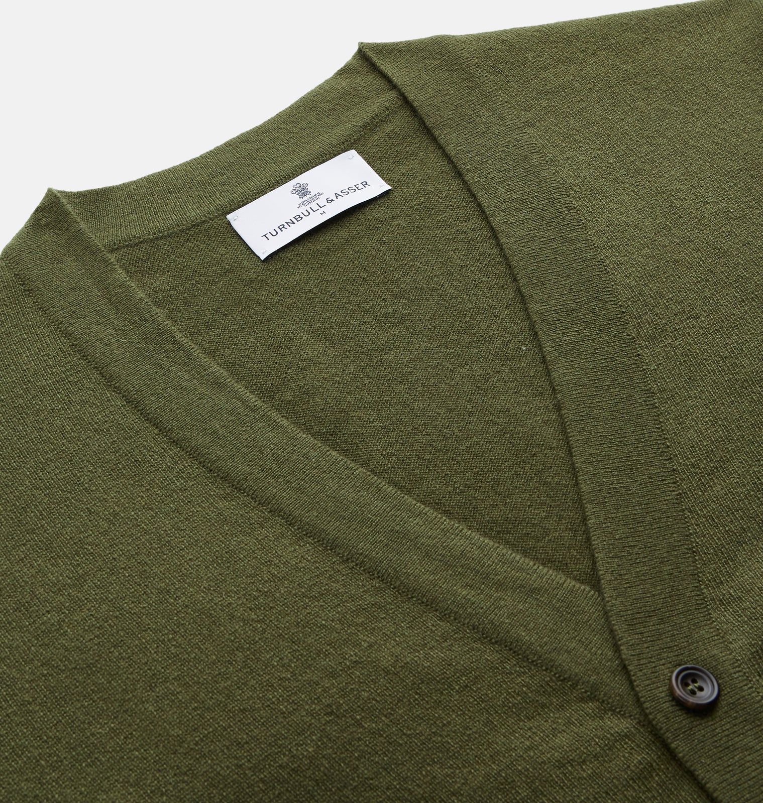 View 2 of product The Olive Lachlan Cashmere Cardigan by Turnbull & Asser features long sleeves, two front pockets, a V-neckline, and ribbed cuffs and hem—a smart-casual classic shown laid flat on a white background.