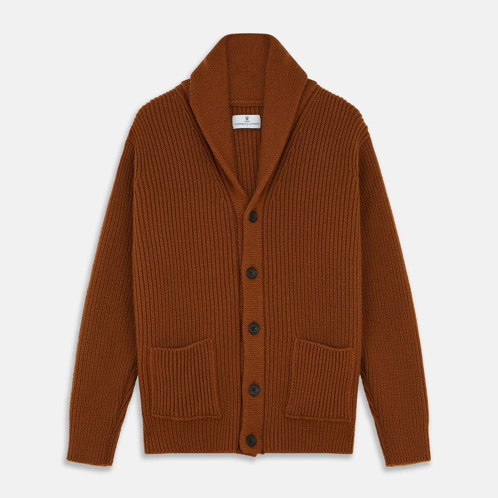 The Brown Ainsley Ribbed Shawl Cashmere Cardigan by Turnbull & Asser features a ribbed knit texture, black front buttons, and two front pockets, displayed laid flat on a white background.