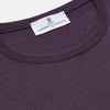View 2 of product The Turnbull & Asser Plum Kingston Merino Crew Neck Jumper is a lightweight, long-sleeve sweater with ribbed cuffs and hem, shown flat on a white background. Its solid plum color and classic design offer timeless style.
