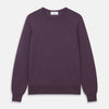 View 1 of product The Turnbull & Asser Plum Kingston Merino Crew Neck Jumper is a lightweight, long-sleeve sweater with ribbed cuffs and hem, shown flat on a white background. Its solid plum color and classic design offer timeless style.