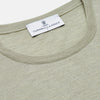 View 2 of product The Light Green Kingston Merino Crew Neck Jumper by Turnbull & Asser is laid flat, displaying its classic design with ribbed cuffs, hem, and neckline.