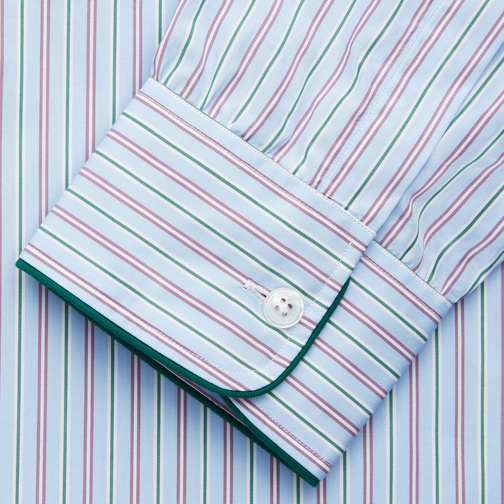 The Blue, Purple & Green Stripe Nightshirt by Turnbull & Asser is a long-sleeved, knee-length traditional nightshirt with a pointed collar, breast pocket with green trim, front buttons, and buttoned cuffs; made in England.