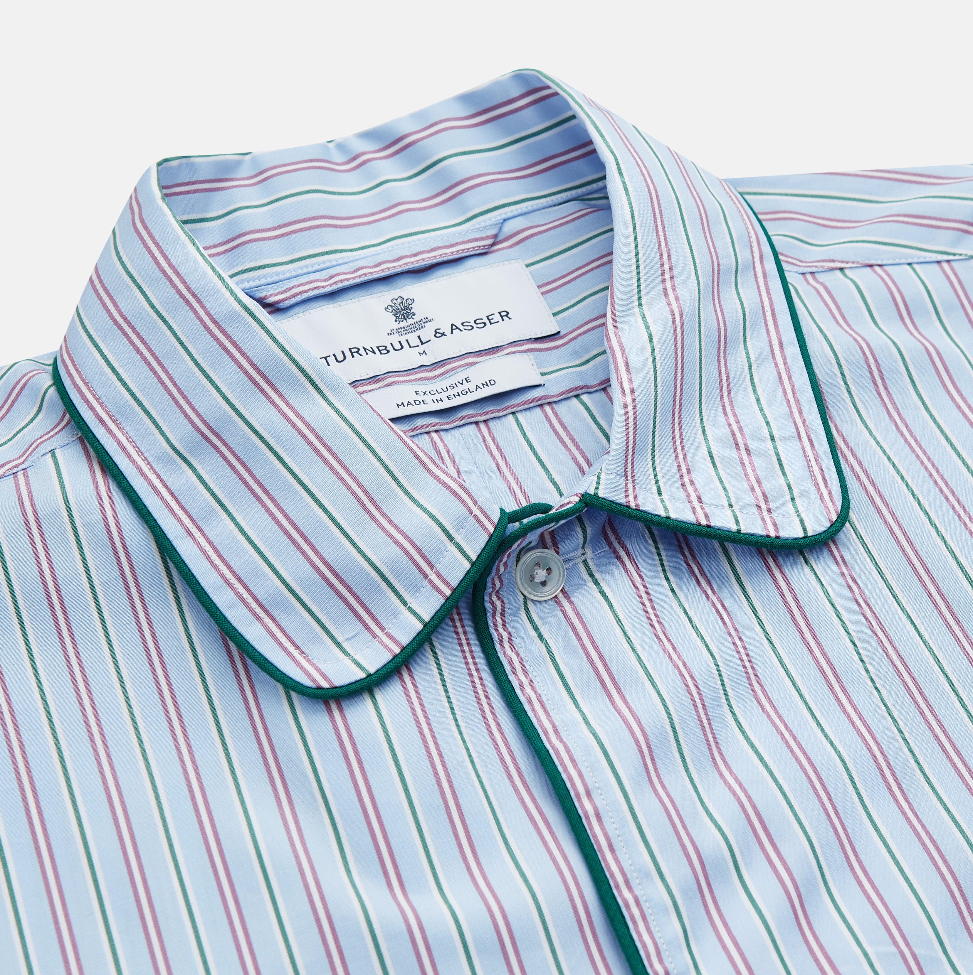 View 2 of product The Blue, Purple & Green Stripe Nightshirt by Turnbull & Asser is a long-sleeved, knee-length traditional nightshirt with a pointed collar, breast pocket with green trim, front buttons, and buttoned cuffs; made in England.
