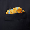 View 3 of product The Turnbull & Asser Yellow & Blue Seahorse Silk Pocket Square features a repeating seahorse pattern in diagonal rows and is handprinted in England, with branding in two corners.