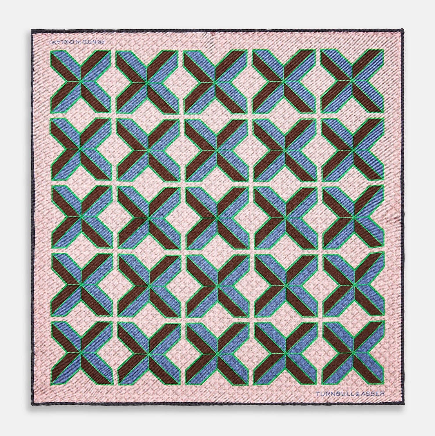 View 1 of product The Pink Multi Crosses Double-Faced Silk Pocket Square by Turnbull & Asser features blue, green, and brown interlocking X-shaped graphics on light pink, with OSINACHI X CJANGO and TURNBULL & ASSER printed at the corners.