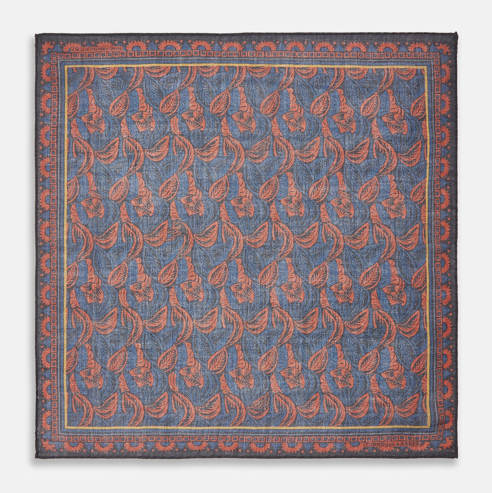 The Turnbull & Asser Navy Multi Camo Birds Wool Twill Pocket Square features a colorful camo bird pattern on navy wool twill with multicolor borders and a geometric edge design. Made in Italy.