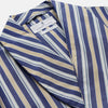 View 3 of product The Turnbull & Asser Blue Multi Stripe Cotton Gown features blue and white vertical stripes, long sleeves, a shawl collar, front pockets, and a matching waist tie, shown on a plain white background.