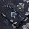 View 4 of product The Navy Floral Silk Jacquard Pierce Gown by Turnbull & Asser features a shawl collar, long sleeves, matching fabric belt, and elegant grey and blue floral design.