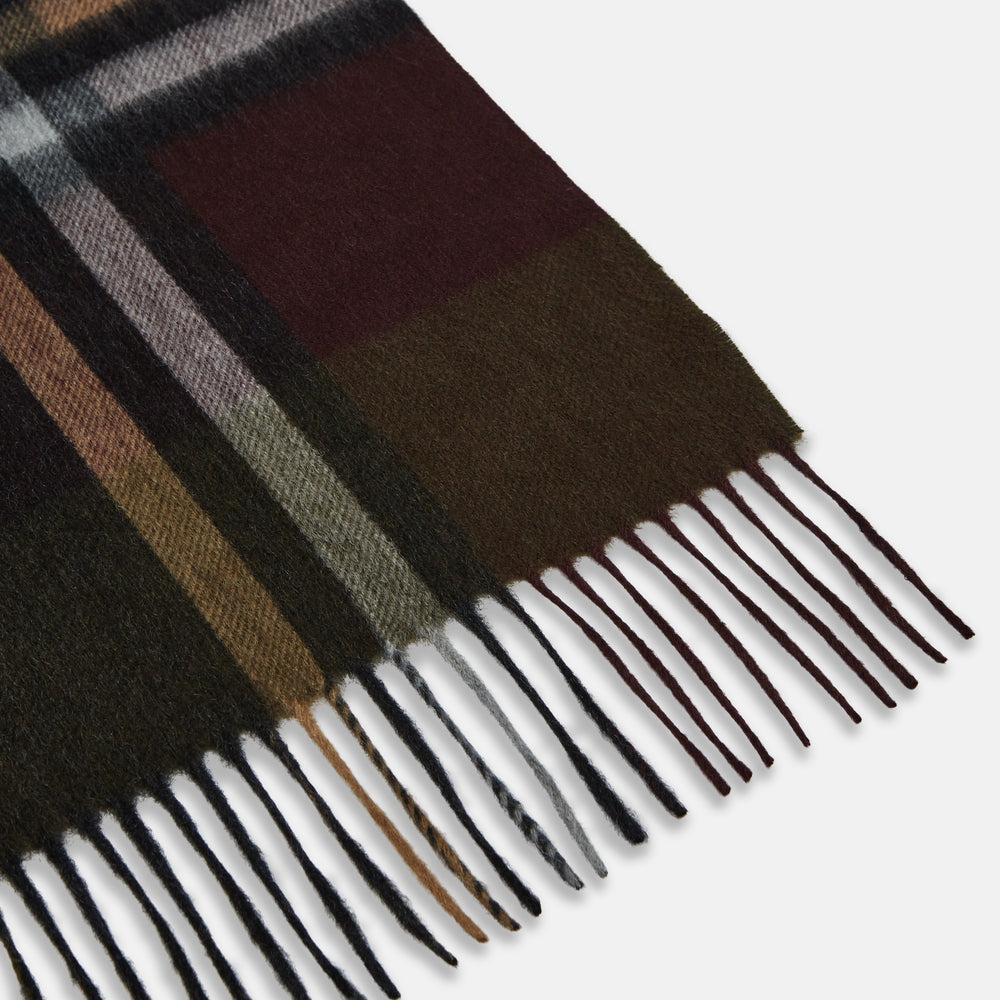 The Turnbull & Asser Dark Green Multi Check Cashmere Wilde Stole Scarf features a large plaid pattern in dark green, brown, black, and beige with fringed ends. Made in Scotland, it is shown against a white background.