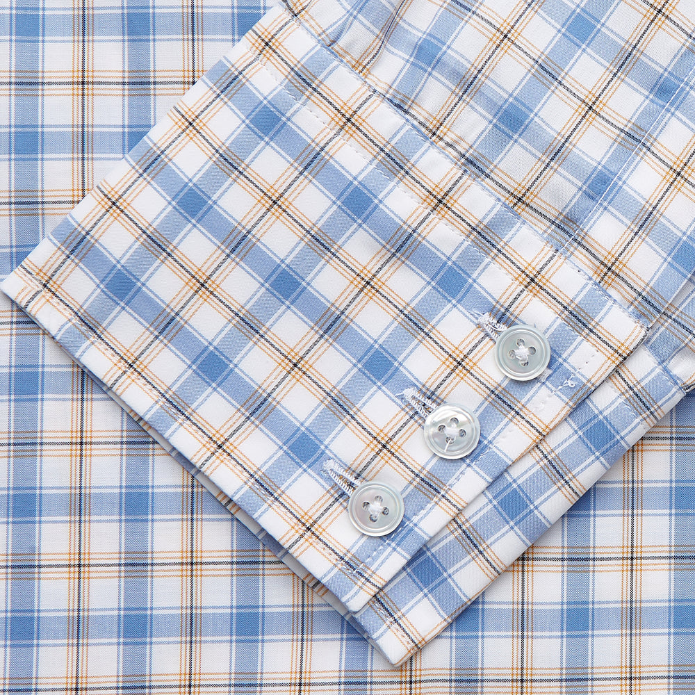 The Turnbull & Asser Blue Multi Check Regular Fit Shirt features a T&A collar, 3 button cuffs, a blue, tan, and white check pattern, and is crafted from Italian cotton poplin. It is shown laid flat on a white background.