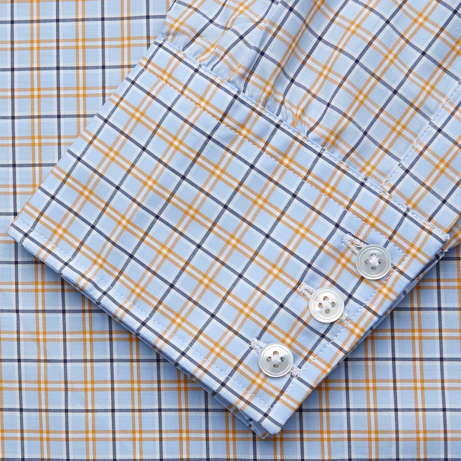 View 3 of product Turnbull & Asser Blue, Orange & Navy Check Regular Fit Shirt features a T&A collar and 3 button cuffs, made from Italian cotton poplin, shown flat on a white background.