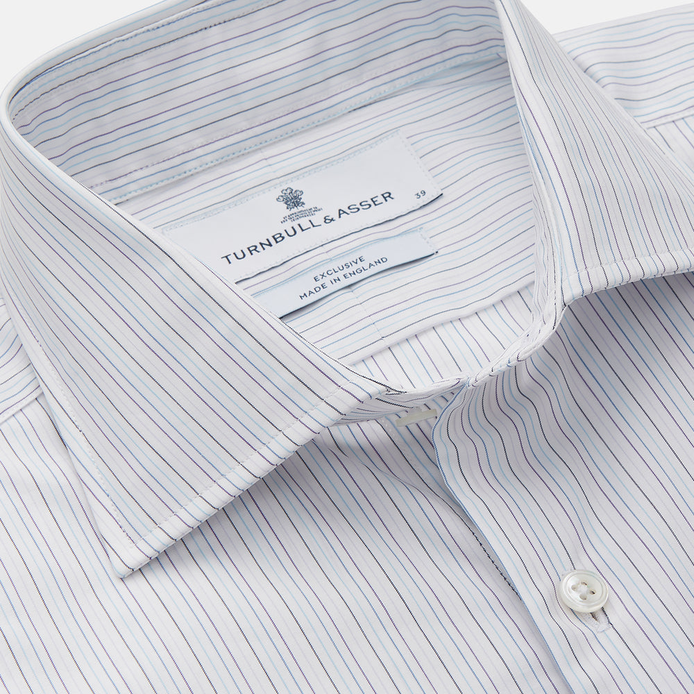 The Turnbull & Asser Purple Multi Stripe Tailored Fit Shelton Shirt features a Kent collar and buttoned cuffs, with a vertical pinstripe pattern, displayed flat on a white surface.