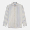 View 1 of product Turnbull & Asser’s Yellow Multi Stripe Tailored Fit Shirt features a Kent collar, blue, yellow, and white stripes on a light background, 2-button cuffs, and a curved hem for a refined look.