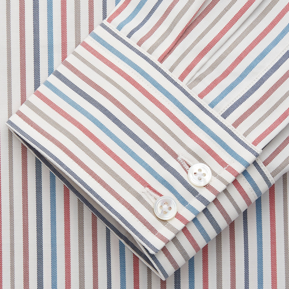 The Turnbull & Asser Burgundy Multi Stripe Tailored Fit Shirt features a Kent collar and 2 button cuffs, with vertical stripes on a light background. The shirt is neatly laid flat on a white surface.