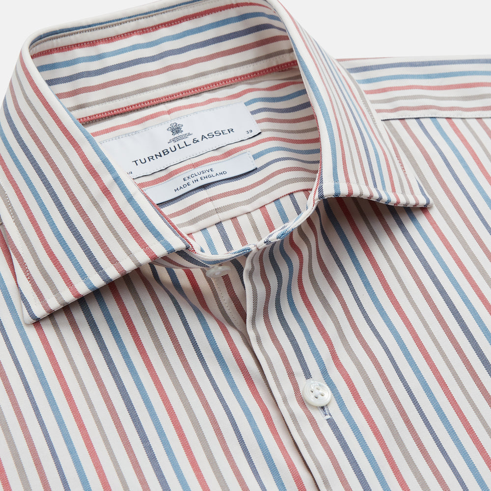 The Turnbull & Asser Burgundy Multi Stripe Tailored Fit Shirt features a Kent collar and 2 button cuffs, with vertical stripes on a light background. The shirt is neatly laid flat on a white surface.