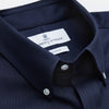 View 2 of product The Turnbull & Asser Navy Weekend Fit Shirt features a Dorset collar, 1 button cuffs, and white buttons, shown laid flat against a white background.