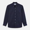 View 1 of product The Turnbull & Asser Navy Weekend Fit Shirt features a Dorset collar, 1 button cuffs, and white buttons, shown laid flat against a white background.