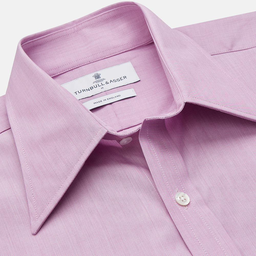 The Turnbull & Asser Pink Weekend Fit Shirt features a Long Point collar, single button cuffs, and a front pocket, shown laid flat on a white background.